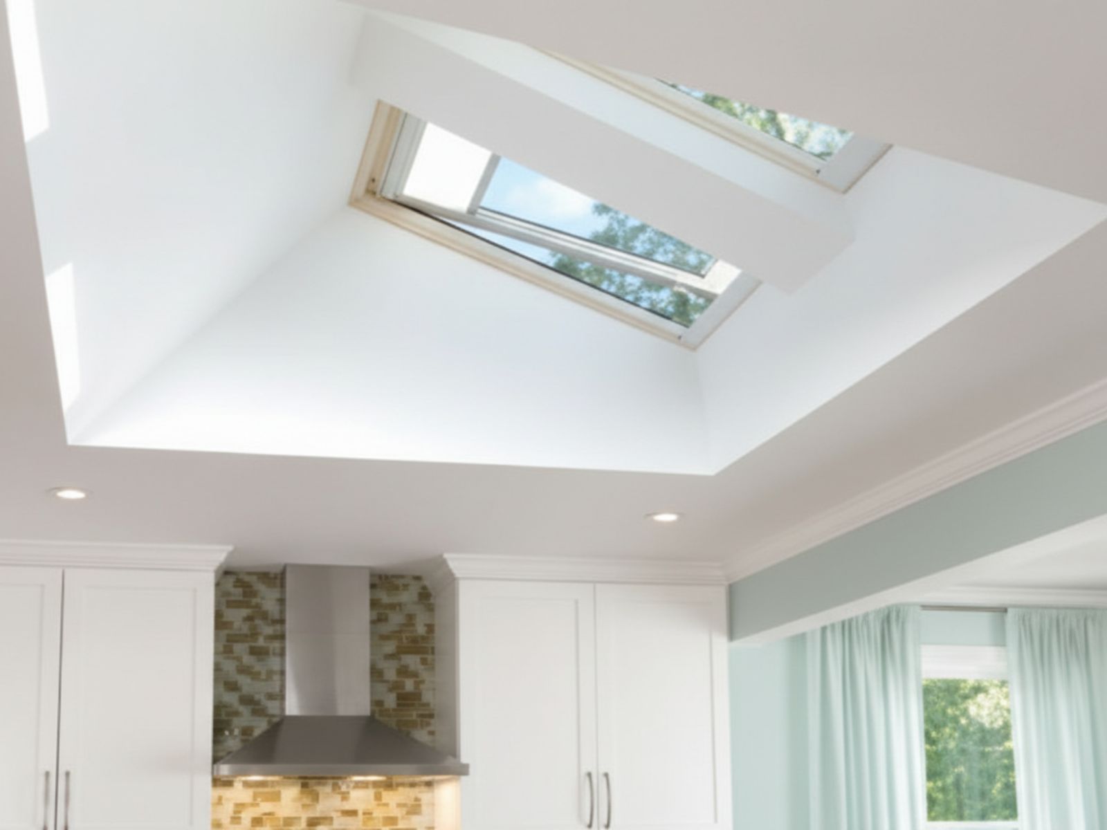 Modern kitchen interior featuring a ceiling skylight that brings natural light into the space and enhances energy efficiency