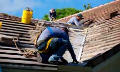 Kelly Roofing crew on a roof near Naples, Florida doing a roof repair.