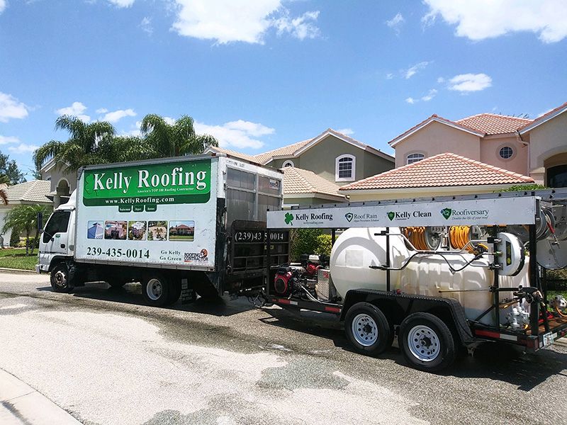 Kelly Roofing truck pulling roof rain container