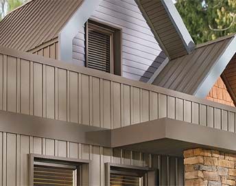 Soffits and Fascia on modern home with standing seam metal roof and siding