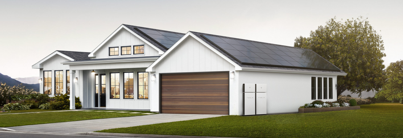 A beautiful white home near Naples, Florida with Tesla Solar Roof panels and a Tesla Solar Wall installed by Kelly Roofing.