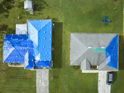Home with Blue Tarp from Hurricaine Damage