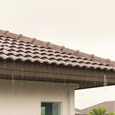 Rain coming down on a tile roof in Florida.