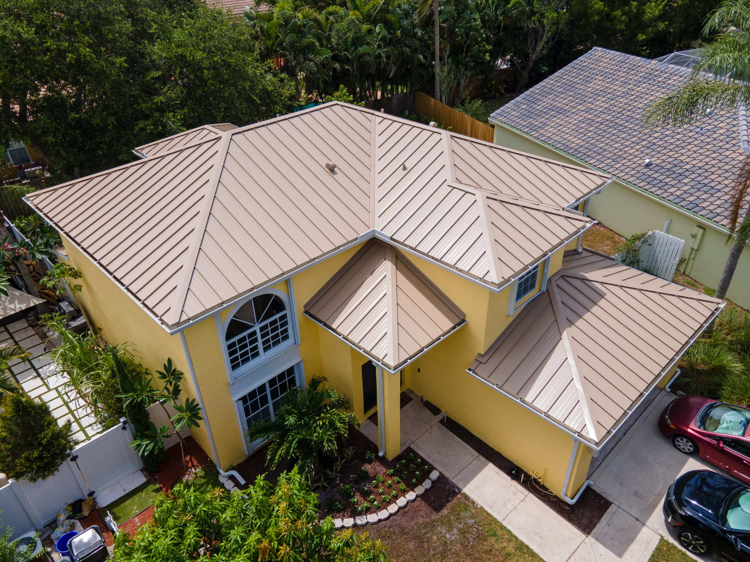 tan metal roof yellow home