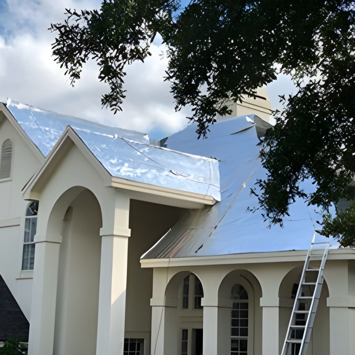 Residential home with radiant barrier foil installed on roof exterior to reflect heat and improve energy efficiency
